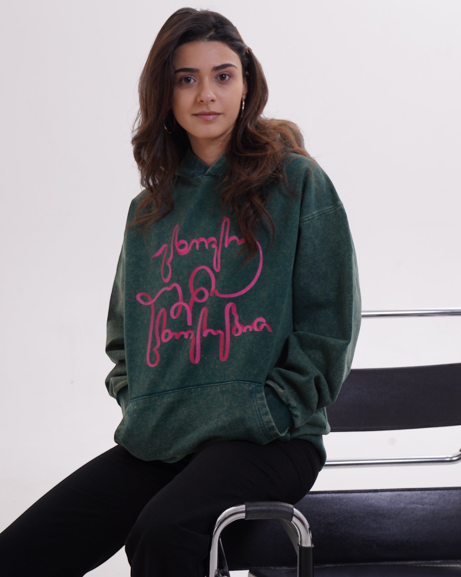 Giovanni Morra x m2 collaboration hoodie featuring the "Live Your Own Life" manifesto in minimalist black and white typography.