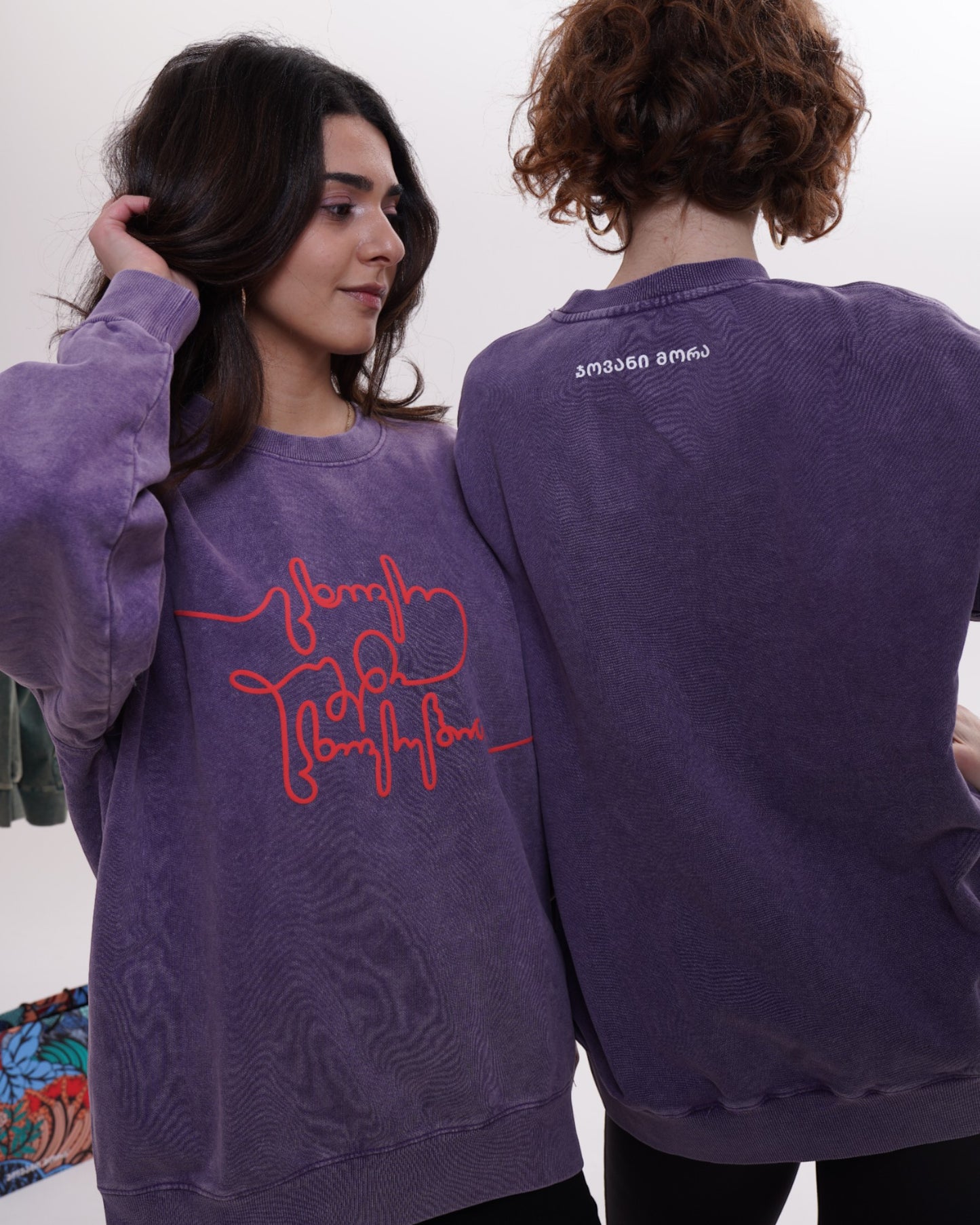 Giovanni Morra x m2 collaboration hoodie featuring the "Live Your Own Life" manifesto in minimalist typography.